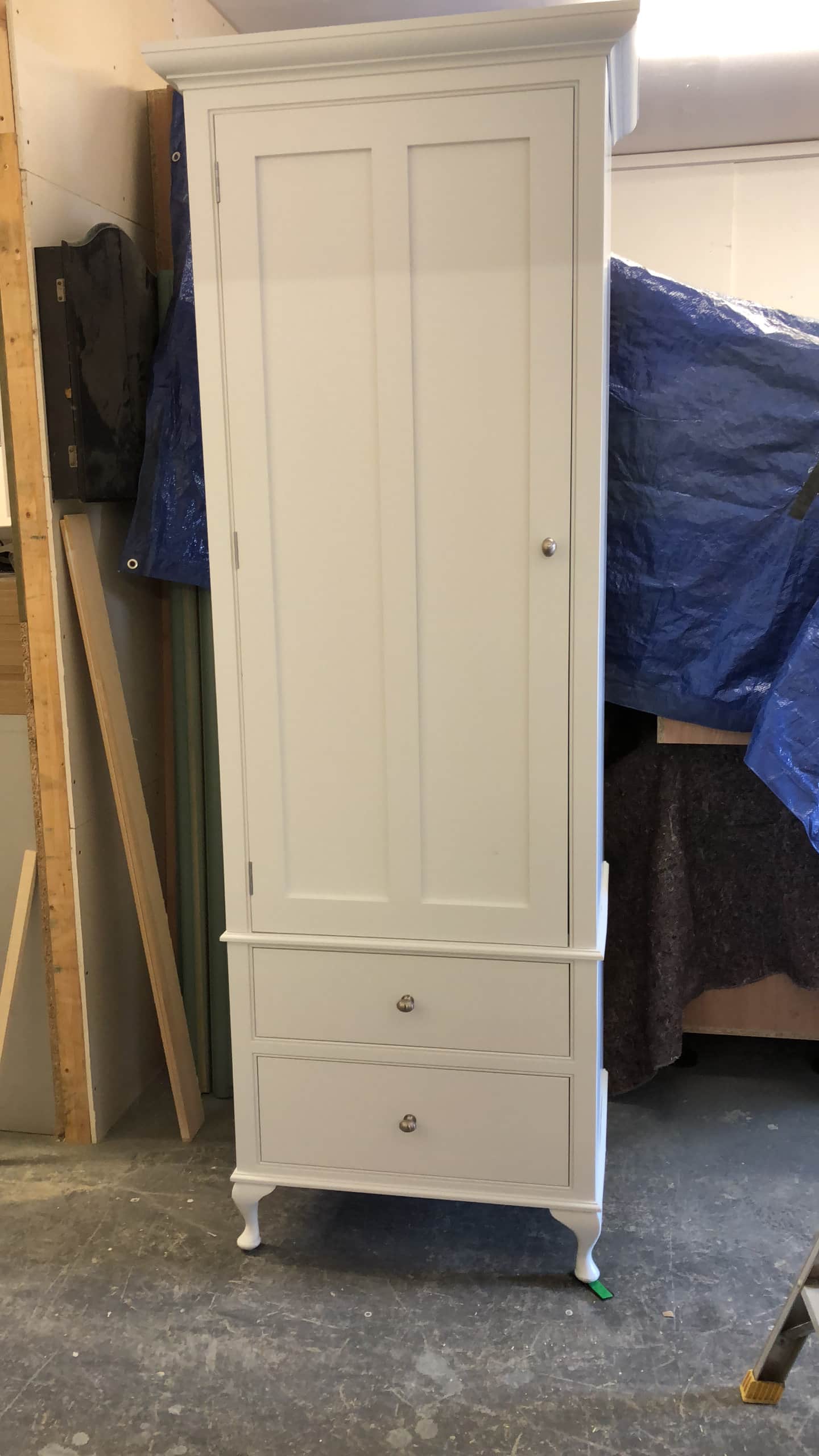 A white, bespoke freestanding wardrobe
