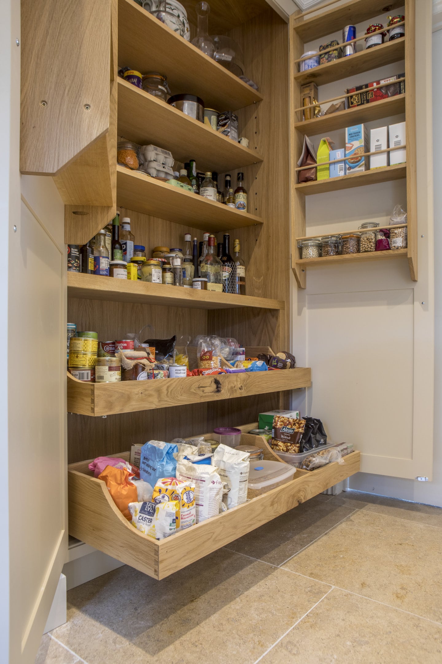 An open pantry showing shelves stacked with food.