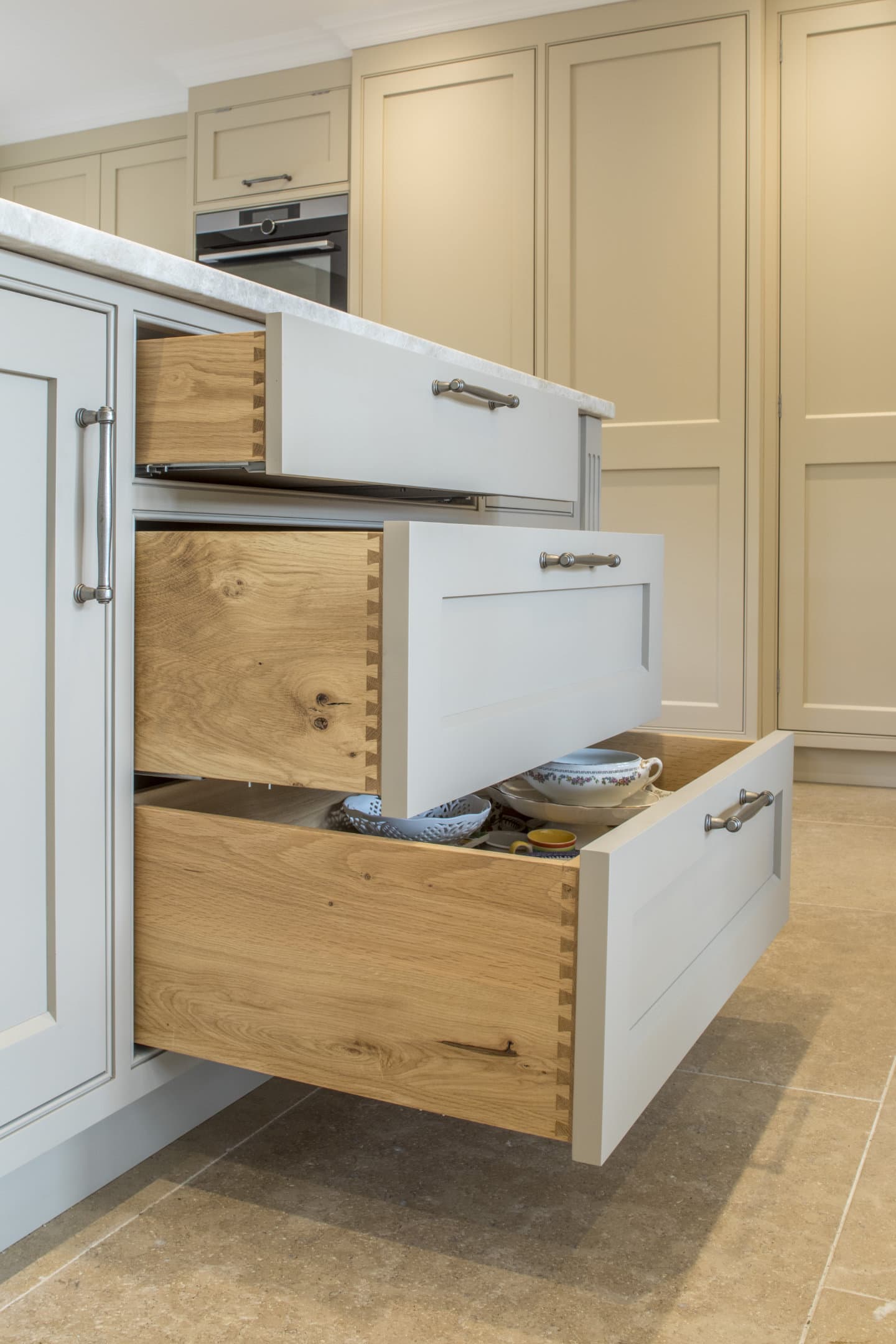 A set of three kitchen drawers opened to different lengths