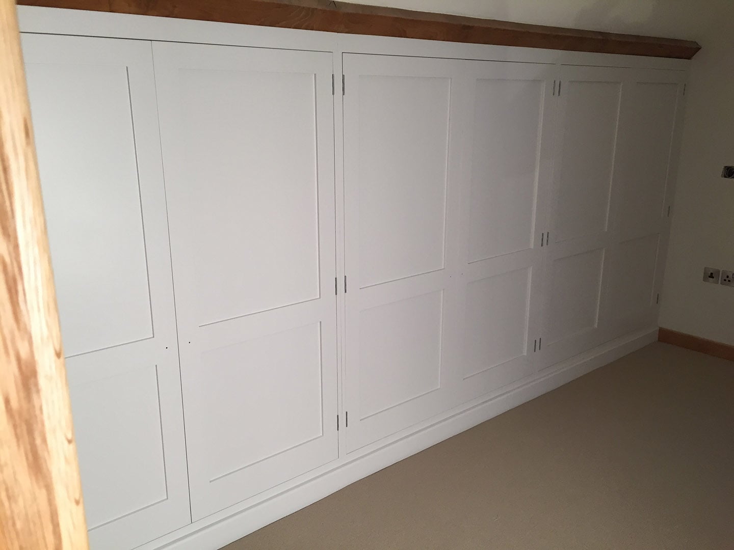 The front of a row of integrated wardrobes.