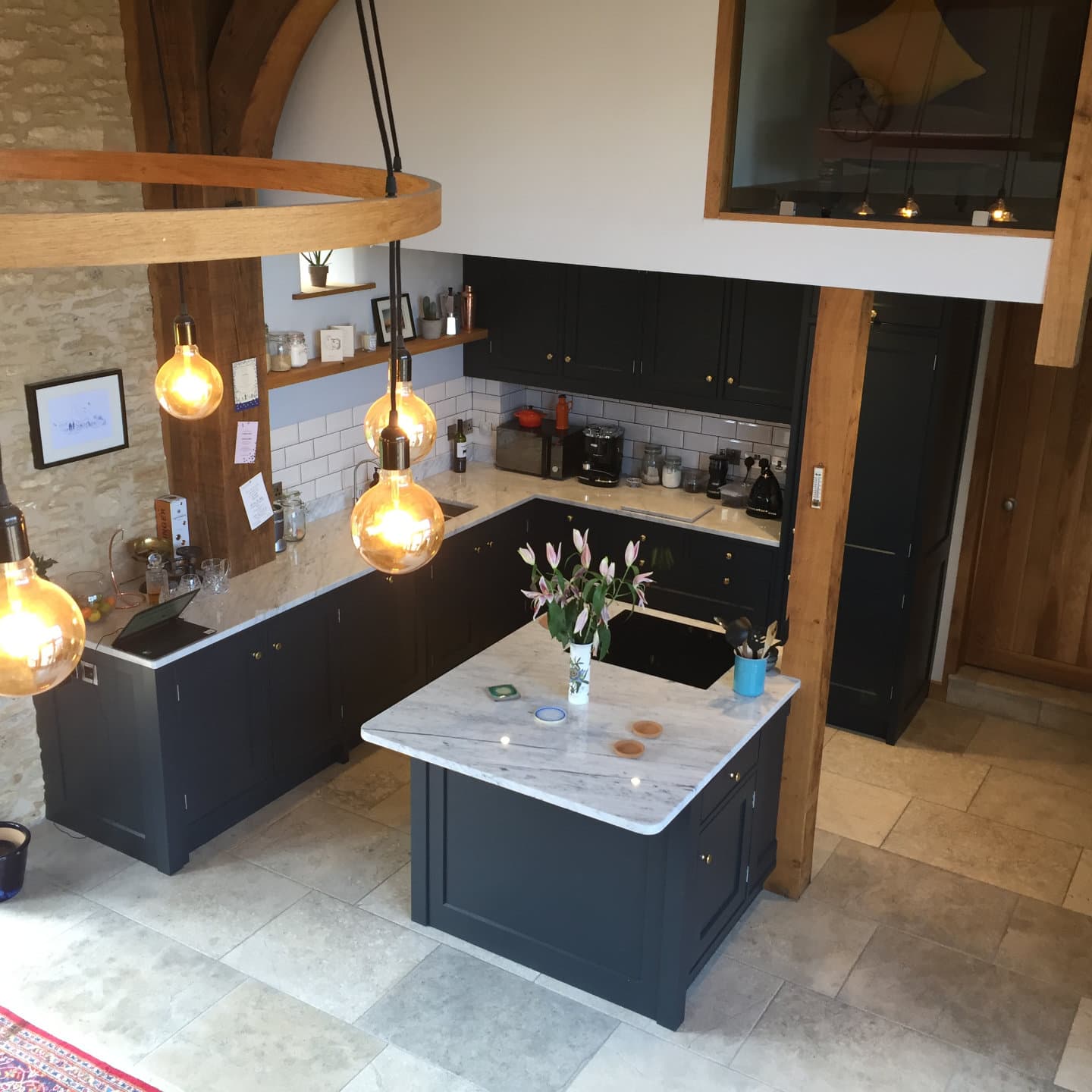 A beautiful kitchen with island counter in a barn conversion