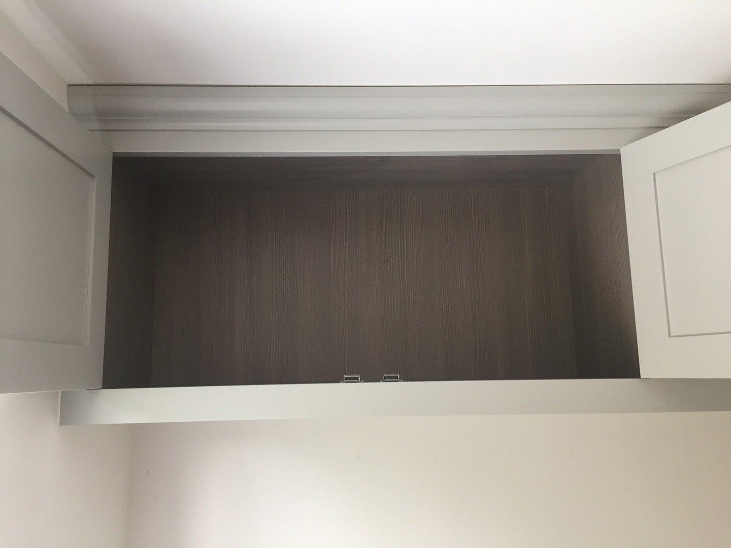 Over head cupboards for storage with the doors open