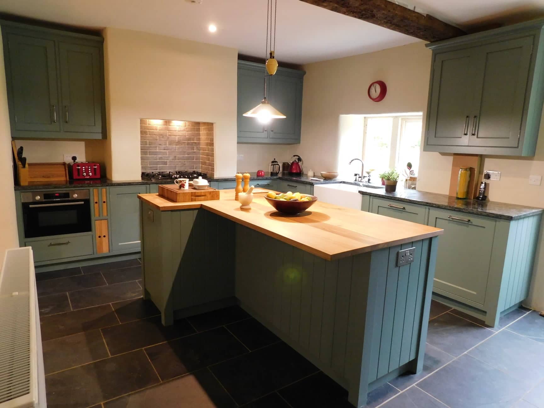 A wide view of a bespoke fitted kitchen