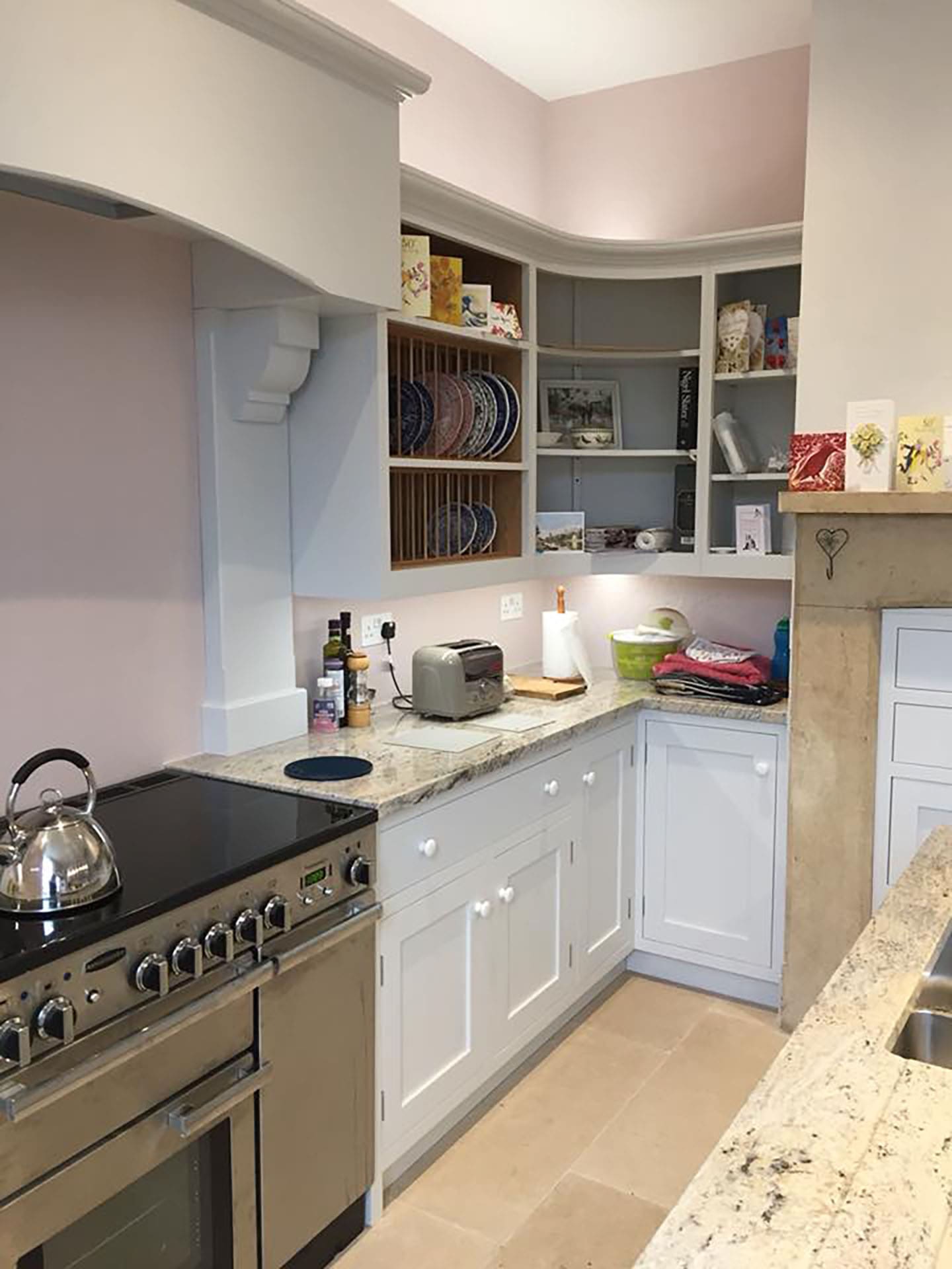Kitchen cupboards beside a cooking stove