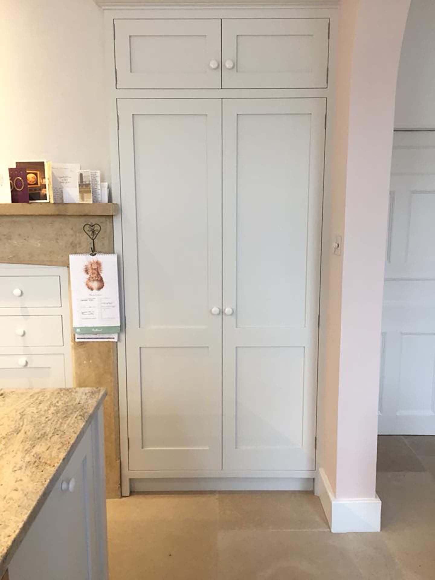 The doors to a bespoke fitted pantry